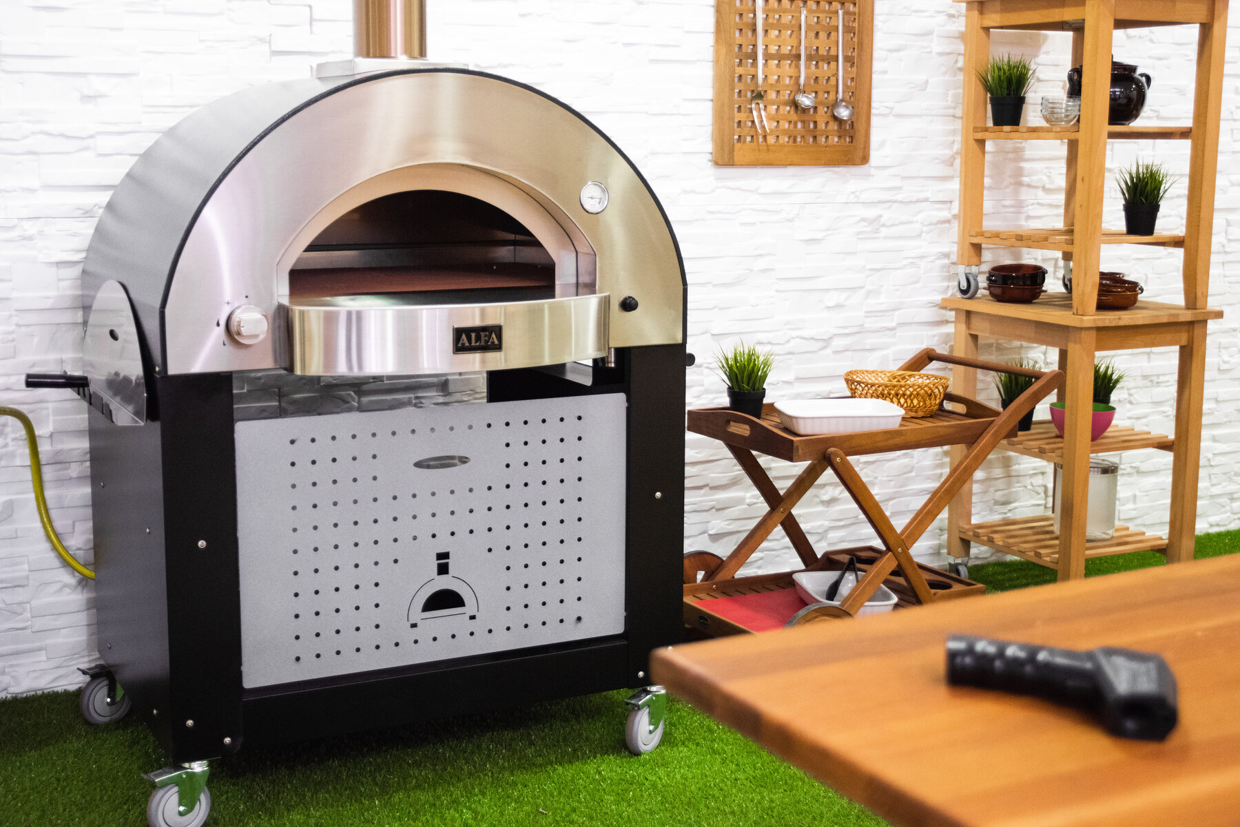 Support base with locking caster wheels and perforated steel panel