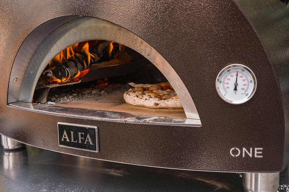 Pizza baking inside an Alfa Forninox oven